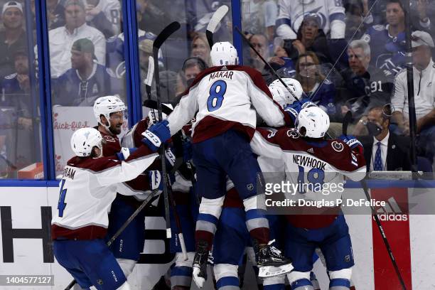 Cale Makar of the Colorado Avalanche and teammates celebrate after Nazem Kadri scores a goal against Andrei Vasilevskiy of the Tampa Bay Lightning to...