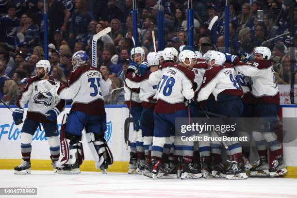 Nazem Kadri of the Colorado Avalanche celebrates with teammates after scoring a goal against Andrei Vasilevskiy of the Tampa Bay Lightning to win 3-2...