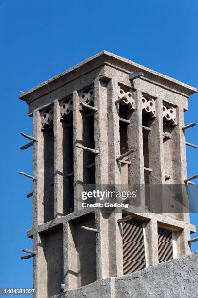 Traditional historical architecture with wind towers in Al Bastakiya historical district in Bur Dubai . Dubai. United Arab Emirates.