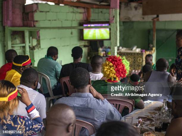 Cameroonian fans watch the Cameroon-Ethiopia match for the 2021 Africa Cup of Nations in Cameroon, January 14 in a makeshift Cameroonian restaurant...