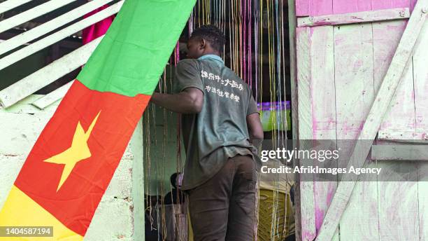 Cameroon flag flies in front of a Cameroonian makeshift restaurant in a popular neighbourhood in Libreville during the Cameroon-Ethiopia match for...