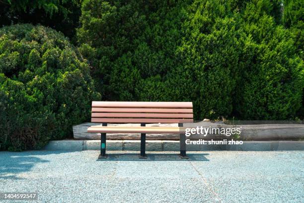 bench in the park - park bench stock pictures, royalty-free photos & images