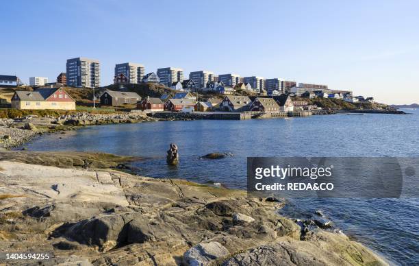 View over the old colonial harbour towards the old town and modern residential areas. Nuuk the capital of Greenland during late autumn. America,...