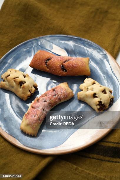 Traditional Italian dessert called Mostaccioli or Mustaccioli, shortcrust pastry and cooked must, typical of the south and central area of Italy,...