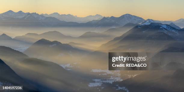 View towards Jachenau and the Allgaeu. View from mount Schoenberg near Lenggries in the bavarian alps during winter. Germany, Bavaria.