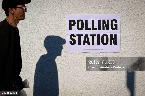 People arrive to vote at Mackarness Hall on June 23, 2022 in Honiton, England.The Tiverton and Honiton Constituency by-election is due to be held on...