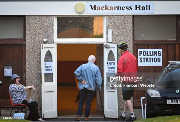 People arrive to vote at Mackarness Hall on June 23, 2022 in Honiton, England.The Tiverton and Honiton Constituency by-election is due to be held on...