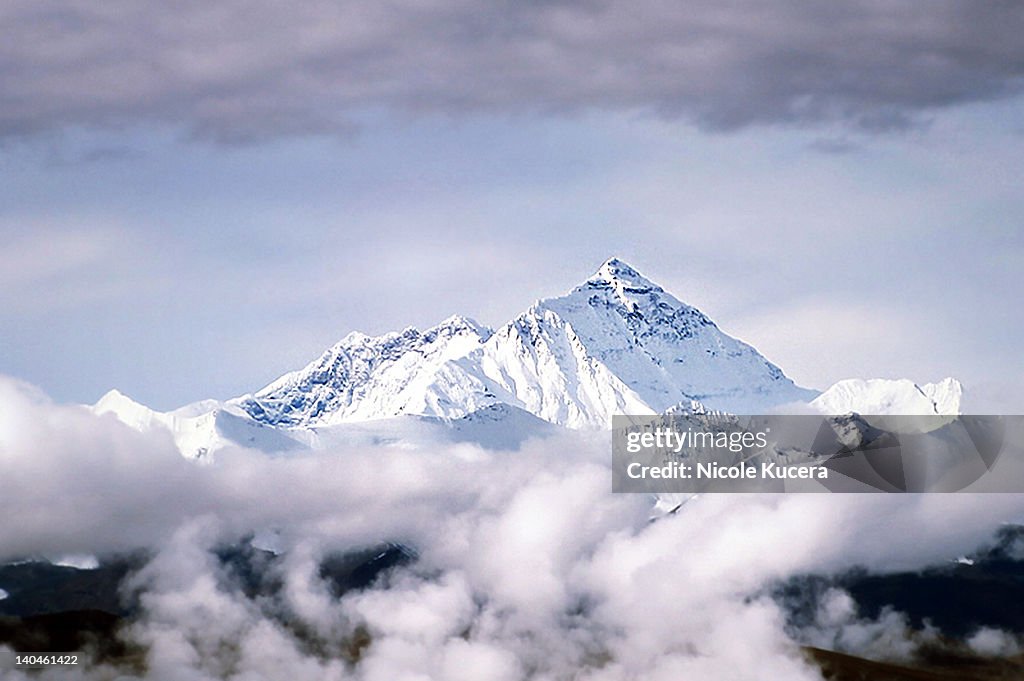 Peak of Mount Everest Above Clouds in Tibet