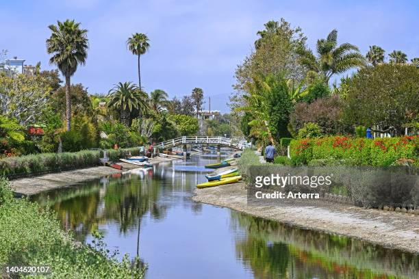 Rowing boats on the banks of one of many canals at seaside resort Venice, neighborhood of the city of Los Angeles, California, United States/USA.
