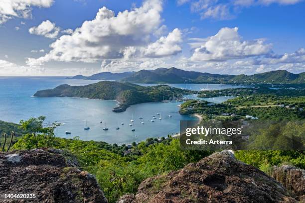 Aerial view over sailing boats and yachts anchored in the English Harbour and Falmouth Harbour bays on the south coast of Antigua island, Caribbean.