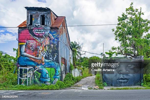 Graffiti on dilapidated buildings near Pointe-à-Pitre, Grande-Terre at Guadeloupe, Lesser Antilles in the Caribbean Sea.