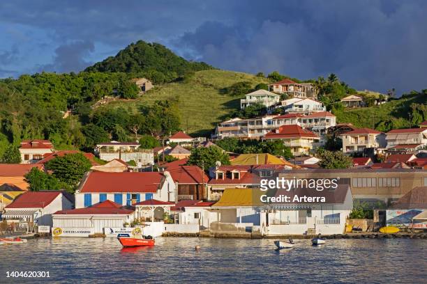 Houses along the Passe de la Baleine at Terre-de-Haut Island, part of Îles des Saintes/Les Saintes, archipelago of Guadeloupe in the Caribbean Sea.