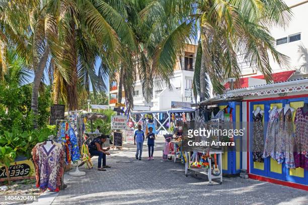 Souvenirs shop and palm trees along boulevard in the capital city Philipsburg of the Dutch island part of Sint Maarten/Saint Martin in the Caribbean.