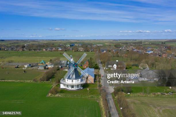Aerial view over windmill in Borgsum on the island of Föhr in the district of Nordfriesland/North Frisia, Schleswig-Holstein, Germany.