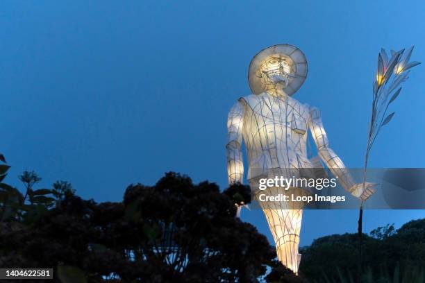 The illuminated figure of an Edwardian Plant Hunter made out of paper and withies displayed as part of the Trebah Garden of Light event in Cornwall.