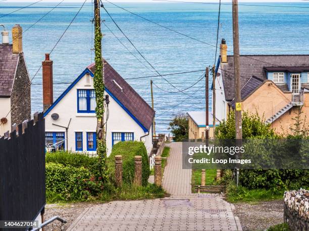 The path between houses leading down to Tresaith beach in Ceredigion in Wales.