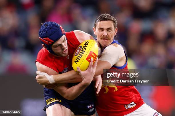 Joe Daniher of the Lions tackles Angus Brayshaw of the Demons during the round 15 AFL match between the Melbourne Demons and the Brisbane Lions at...