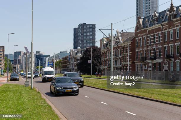 daytime traffic on the 'westzeedijk' in rotterdam - ambulance approaching stock pictures, royalty-free photos & images