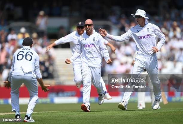 England bowler Jack Leach celebrates with Joe Root after he had taken the wicket of Will Young during day one of the third Test Match between England...