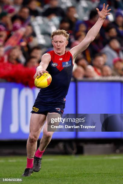 Clayton Oliver of the Demons kicks the ball during the round 15 AFL match between the Melbourne Demons and the Brisbane Lions at Melbourne Cricket...