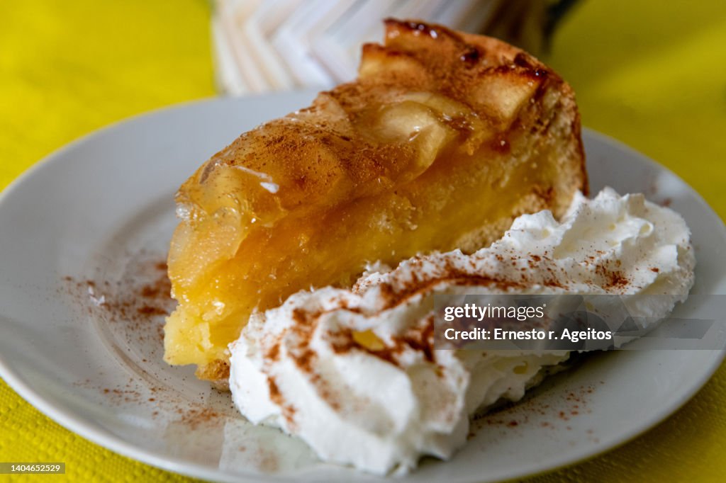 Apple pie with cinnamon and whipped cream