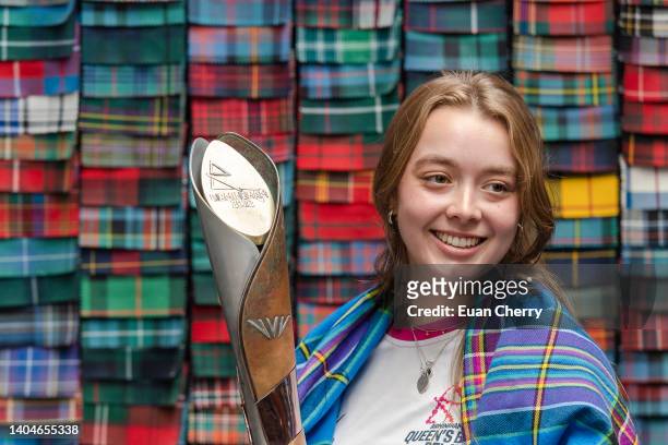 Baton bearer Alice Milivoyevich wears the Commonwealth games - Team Scotland 2022 tartan at Lochcarron of Scotland weavers during the Birmingham 2022...