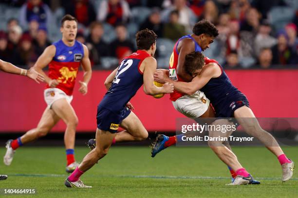 Jack Viney of the Demons tackles Keidean Coleman of the Lions during the round 15 AFL match between the Melbourne Demons and the Brisbane Lions at...