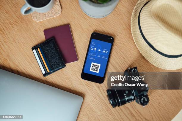 packing suitcase for business and leisure travel - airplane ticket on table stock pictures, royalty-free photos & images