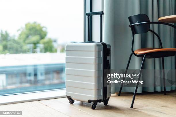 luggage in the hotel room - スーツケース ストックフォトと画像
