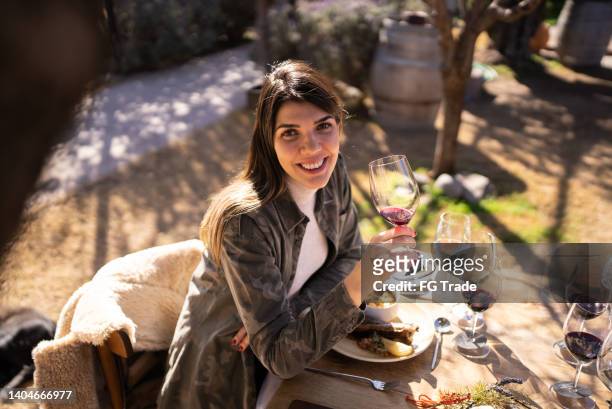 portrait of mid adult woman on a winetasting event - mendoza argentina stock pictures, royalty-free photos & images