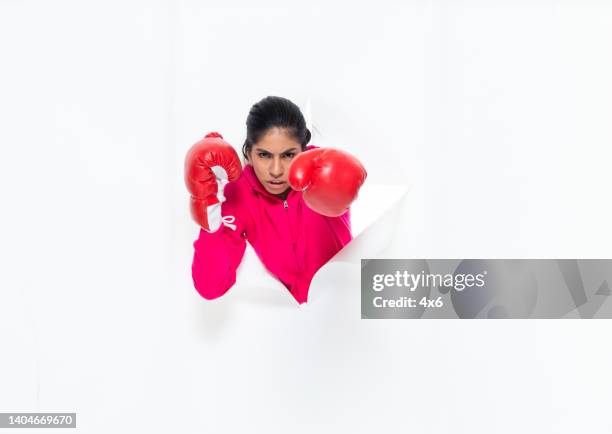 Paper Boxing Golves 30 Boxing Glove Punching Through Paper Stock Photos, High-Res Pictures ...
