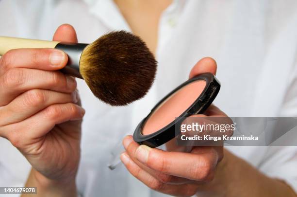 blush - applying makeup with brush foto e immagini stock