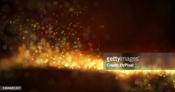 abstract blurry defocused lights & particles - nebula gold stock-fotos und bilder