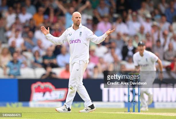 Jack Leach of England reacts after taking the wicket of Henry Nicholls of New Zealand as it came off the bat of New Zealand's Daryl Mitchell at the...