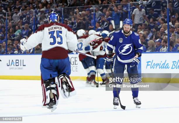 Darcy Kuemper of the Colorado Avalanche celebrates the overtime win as he passed Nikita Kucherov of the Tampa Bay Lightning during Game Four of the...