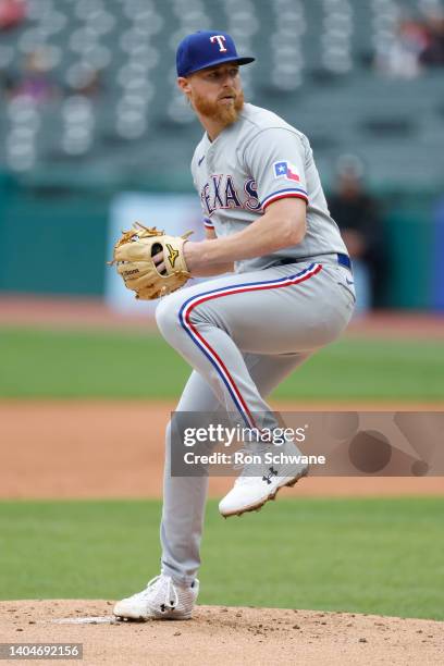 Jon Gray of the Texas Rangers pitches against the Cleveland Guardians during the first inning of game one of a doubleheader at Progressive Field on...