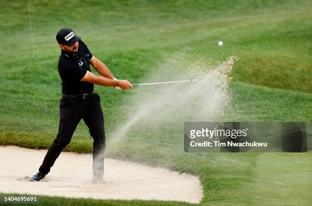 Stephan Jaeger of Germany plays a shot from a bunker on the 13th hole during the first round of Travelers Championship at TPC River Highlands on June...