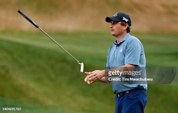 Henrik Norlander of Sweden reacts after a missed putt on the 13th green during the first round of Travelers Championship at TPC River Highlands on...