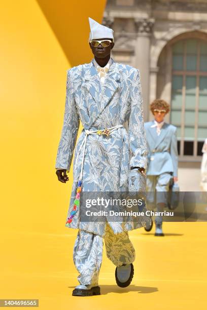 A model walks the runway during the Louis Vuitton Menswear Spring