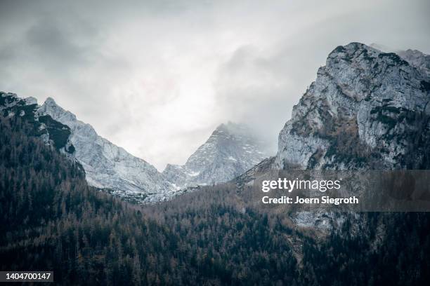 scenic view of storm in the mountains - high up stock-fotos und bilder