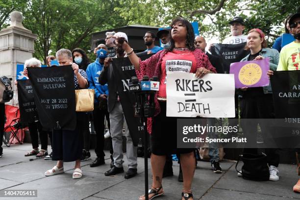 Family members, activists and others hold a rally outside of City Hall to demand that the administration of Mayor Eric Adams do more to address the...