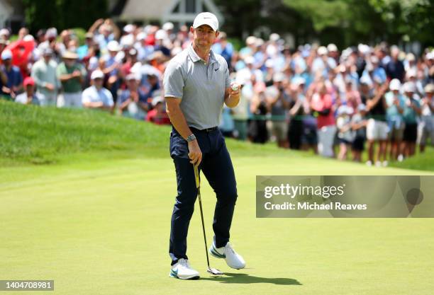 Rory McIlroy of Northern Ireland reacts to his birdie putt on the ninth green during the first round of Travelers Championship at TPC River Highlands...