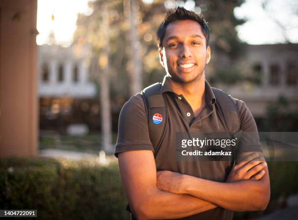 indian college student male with i voted sticker - indian politics and governance stockfoto's en -beelden