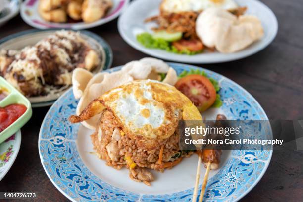 indonesian nasi goreng or fried rice - traditional malay food stock pictures, royalty-free photos & images