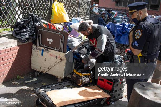 The New York City Department of Sanitation, backed up by police officers, conduct enforced removals of homeless encampments on June 23, 2022 in the...