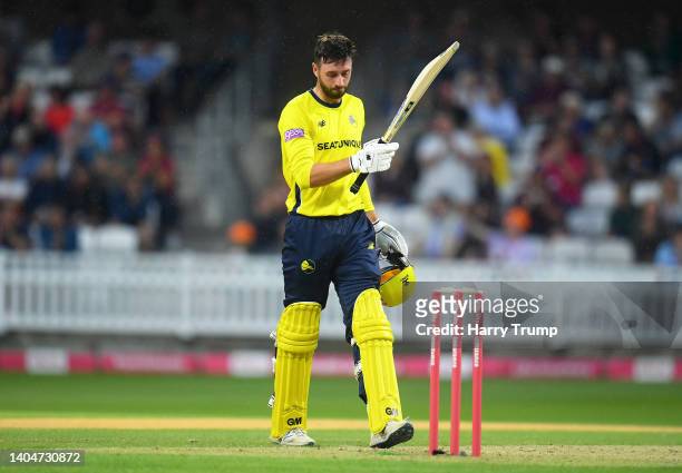 James Vince of Hampshire Hawks celebrates their century during the Vitality T20 Blast match between Somerset and Hampshire Hawks at The Cooper...