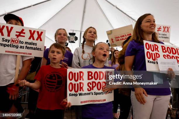 Demonstrators cheer during the speaking program at the "Our Bodies, Our Sports" rally for the 50th anniversary of Title IX at Freedom Plaza on June...