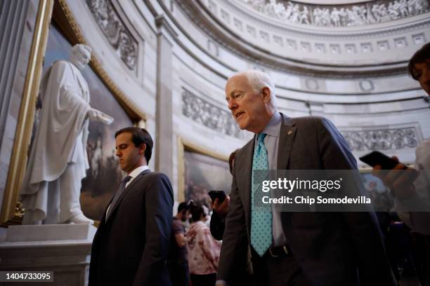 Following a speech on the Senate floor in support of the Bipartisan Safer Communities Act, Senate Minority Whip John Cornyn talks to reporters as he...