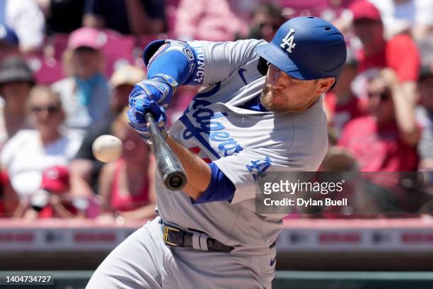 Max Muncy of the Los Angeles Dodgers hits a single in the third inning against the Cincinnati Reds at Great American Ball Park on June 23, 2022 in...