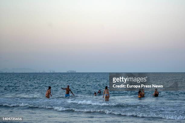 Group of people bathe in the Malvarrosa beach during the Night of San Juan, on 23 June, 2022 in Valencia, Valencian Community, Spain. The traditional...